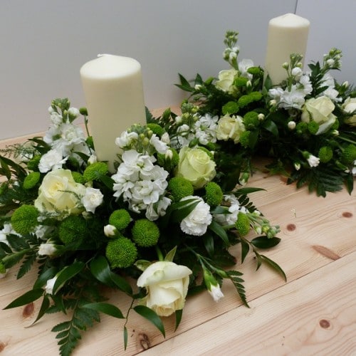 White and green candle table centres