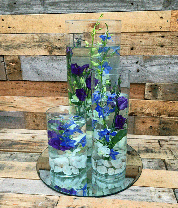 Submerged blue wedding table centres