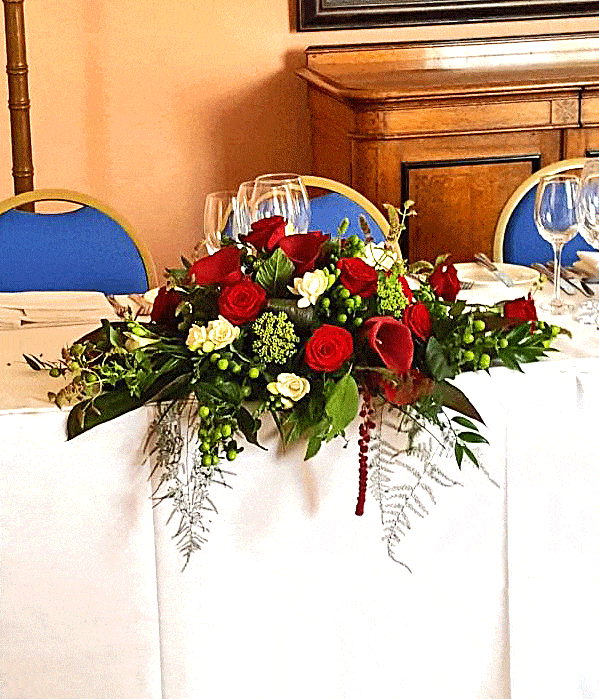 Red and green top table arrangement