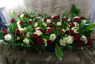 Red and white rose wedding table centres