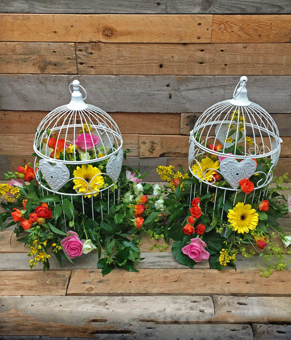 Colourful wedding birdcage table centres